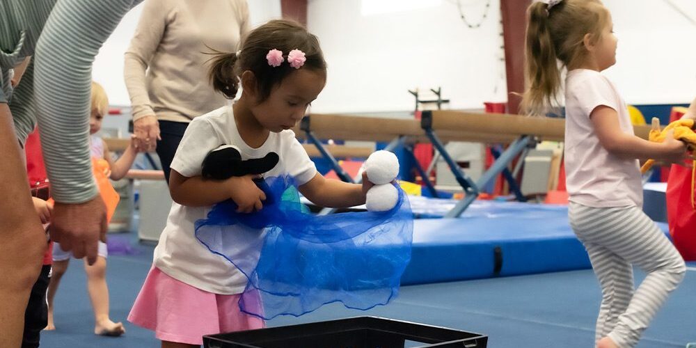 little kids playing at gymnastics camp