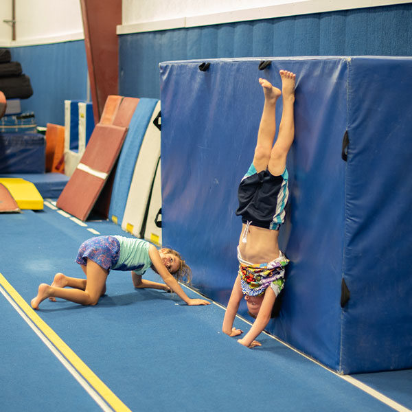 children practicing handstands