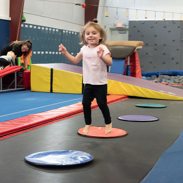 preschooler jumping on a trampoline